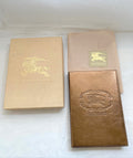 Burberry metallic gold leather cover notebook