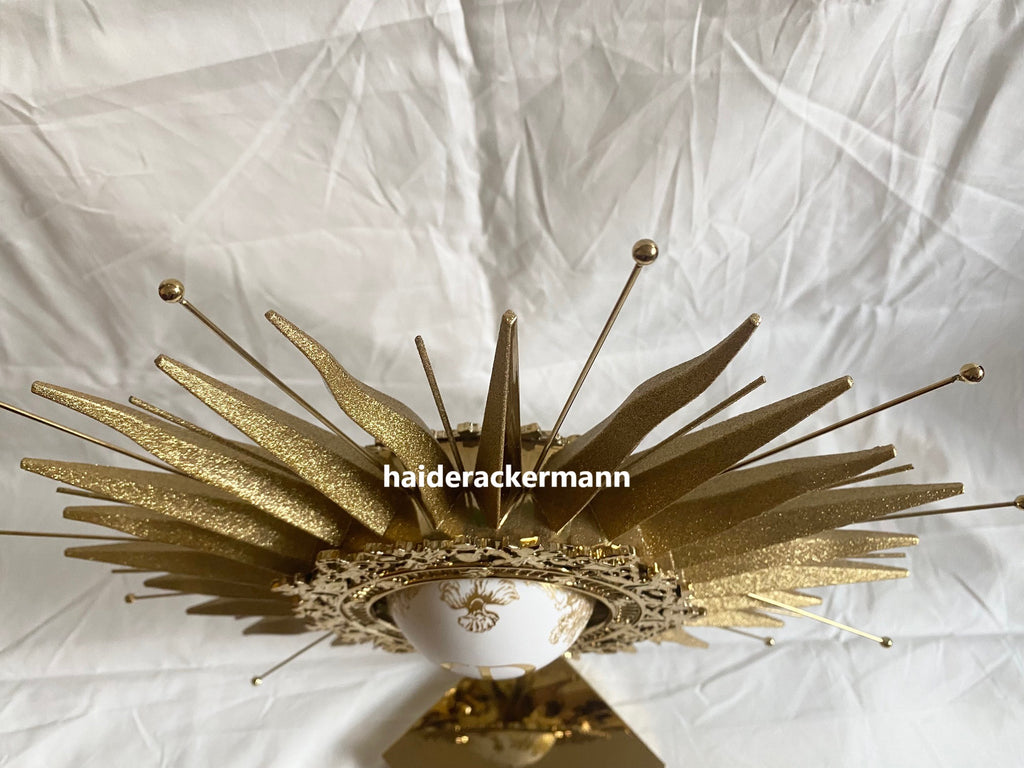 Dior 2024 christmas sun star gold metal stand for window display
