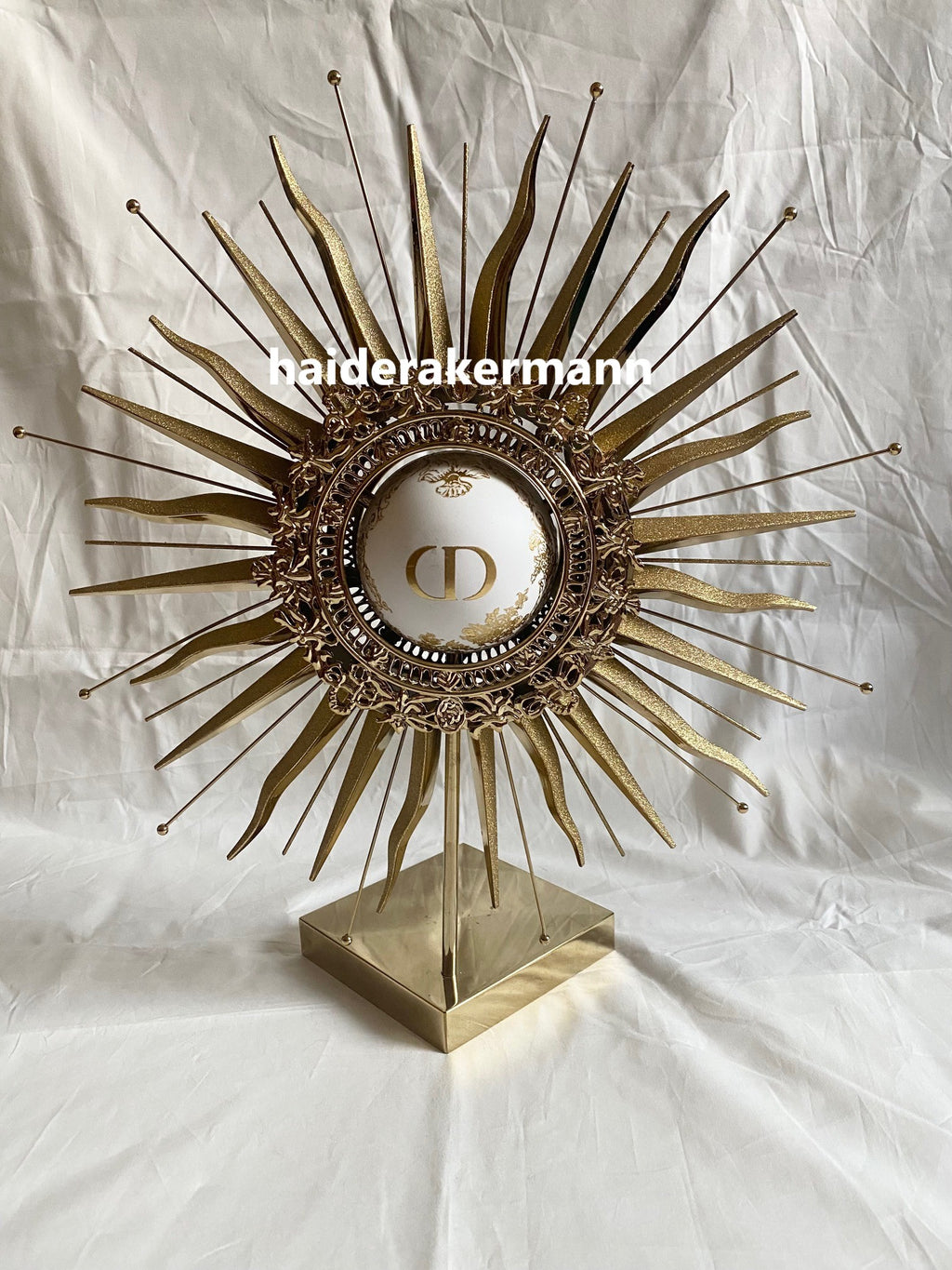 Dior 2024 christmas sun star gold metal stand for window display