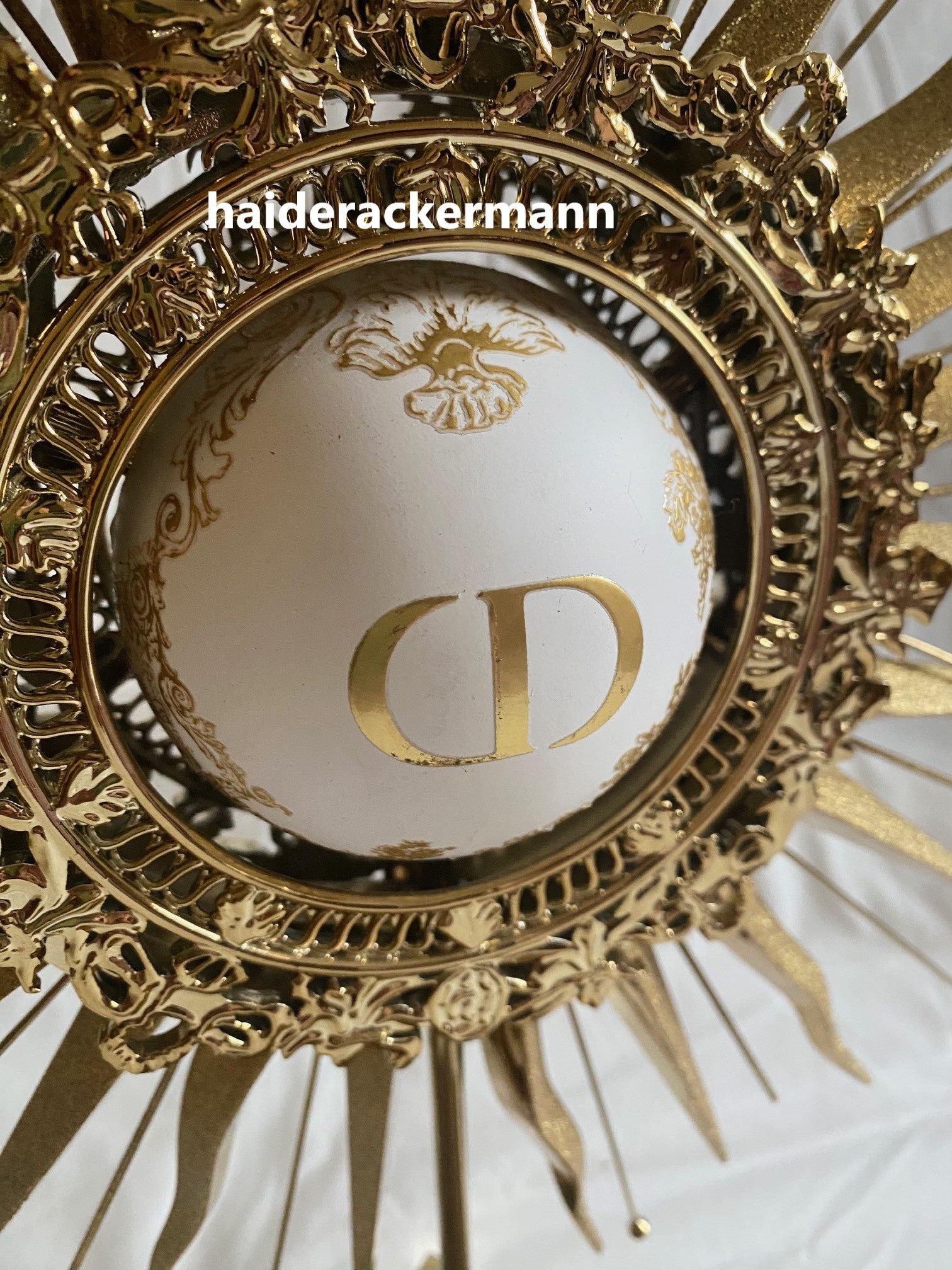 Dior 2024 christmas sun star gold metal stand for window display