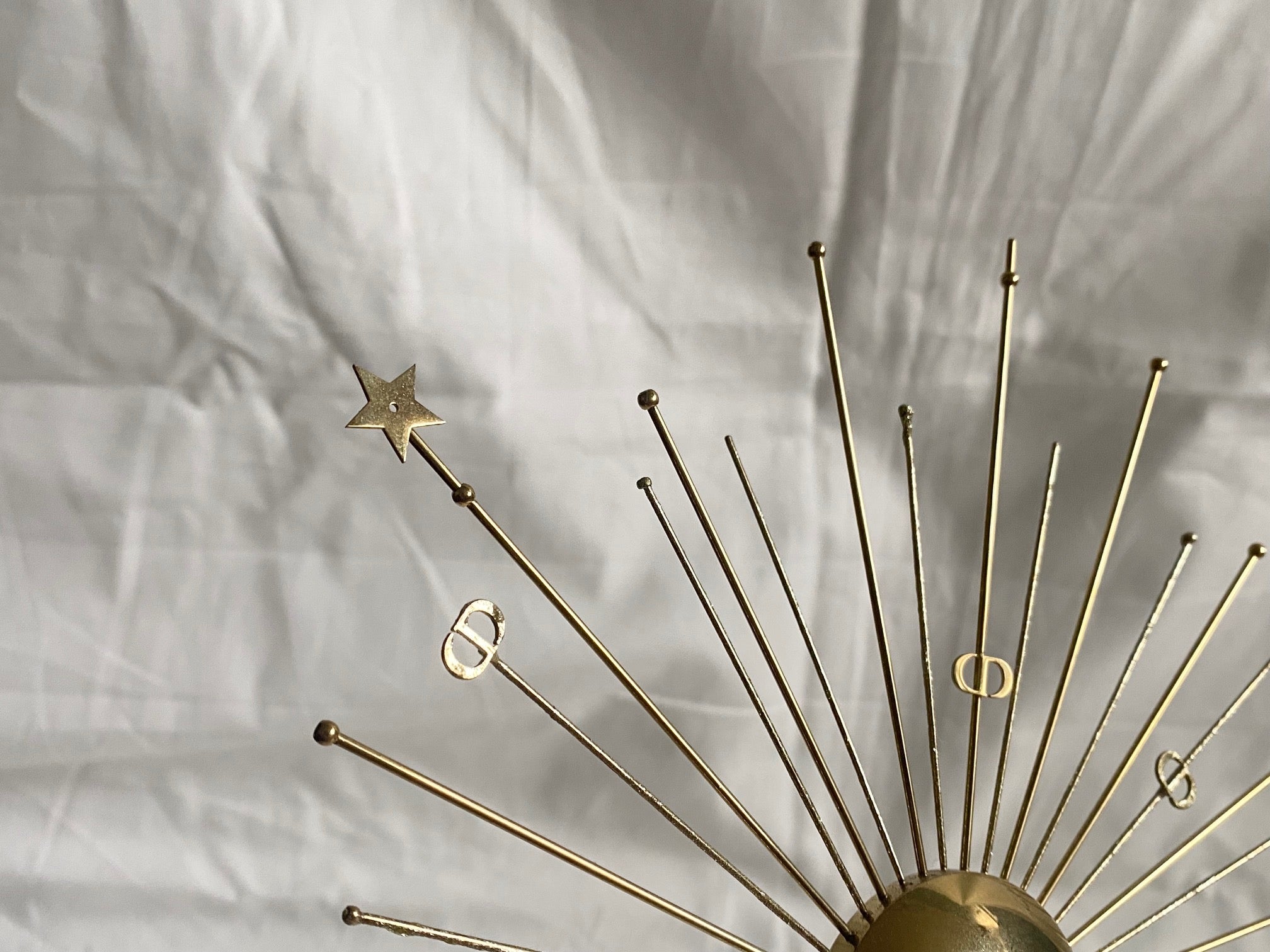 Dior 2024 Christmas CD logo gold metal sun stand for window display