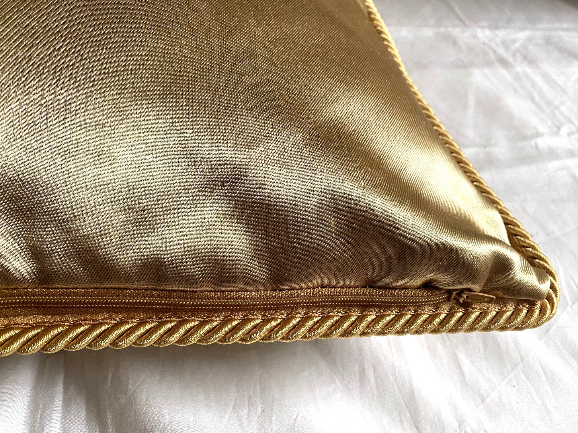 Cartier Christmas event gold satin cushion