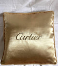 Cartier Christmas event gold satin cushion