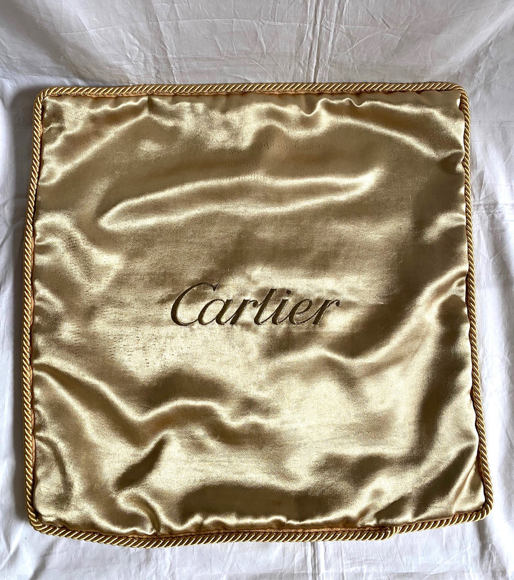 Cartier Christmas event gold satin cushion