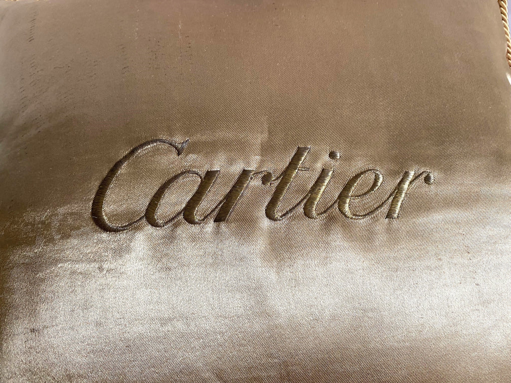 Cartier Christmas event gold satin cushion