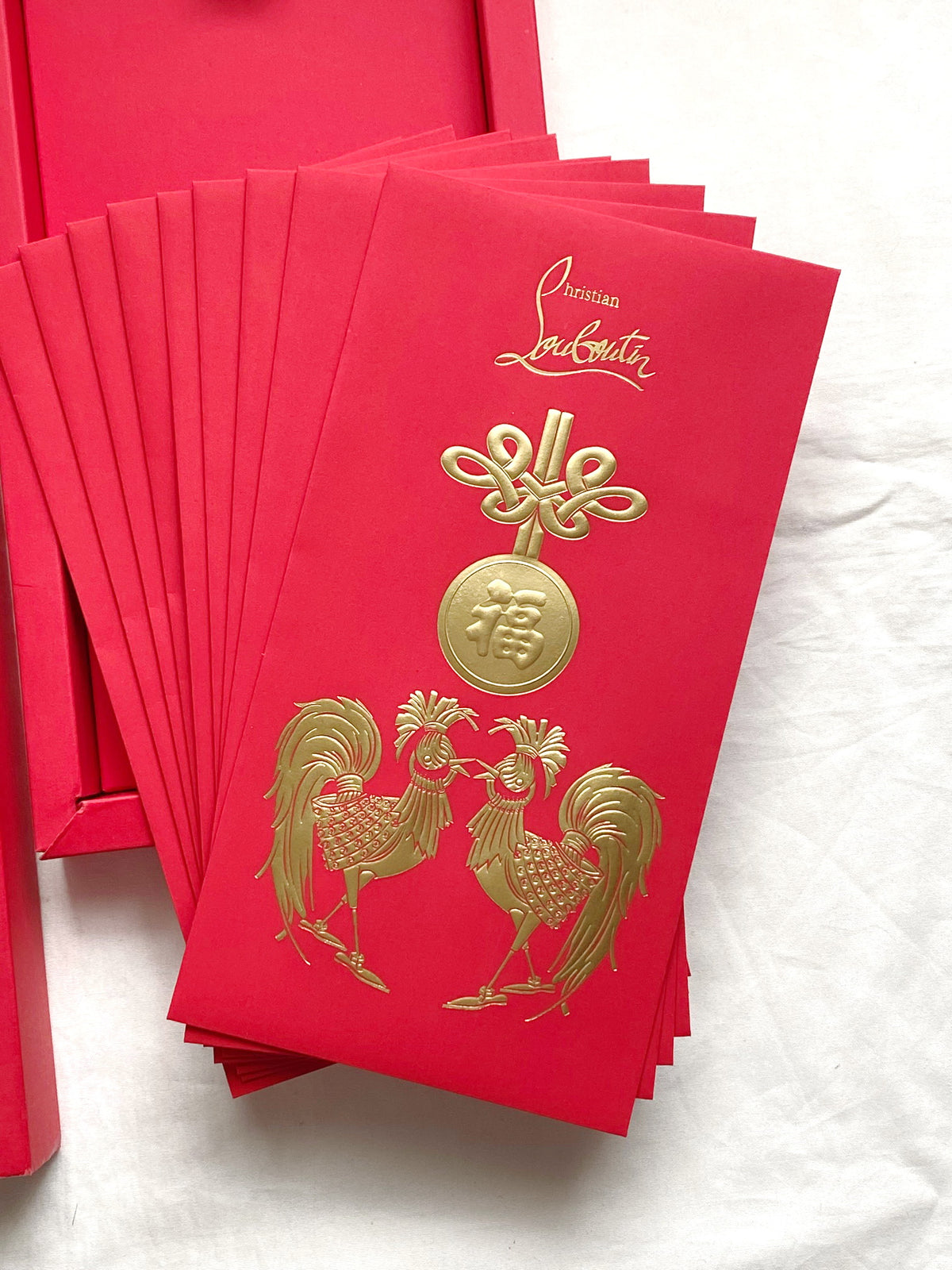 Christian Louboutin 2017 Chinese New Year red packet with rooster motifs