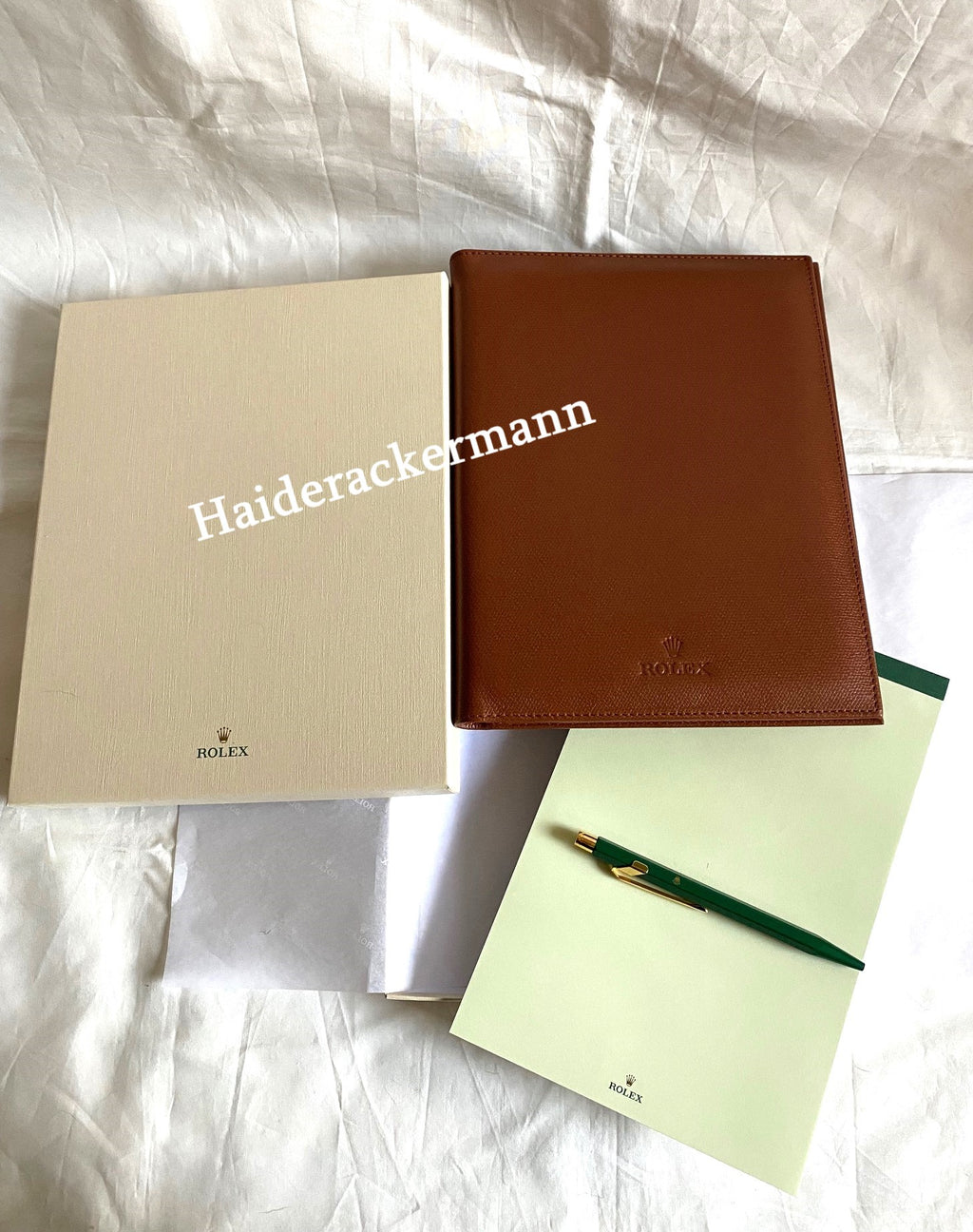 Rolex notebook with leather case & Caran d’Ache pen