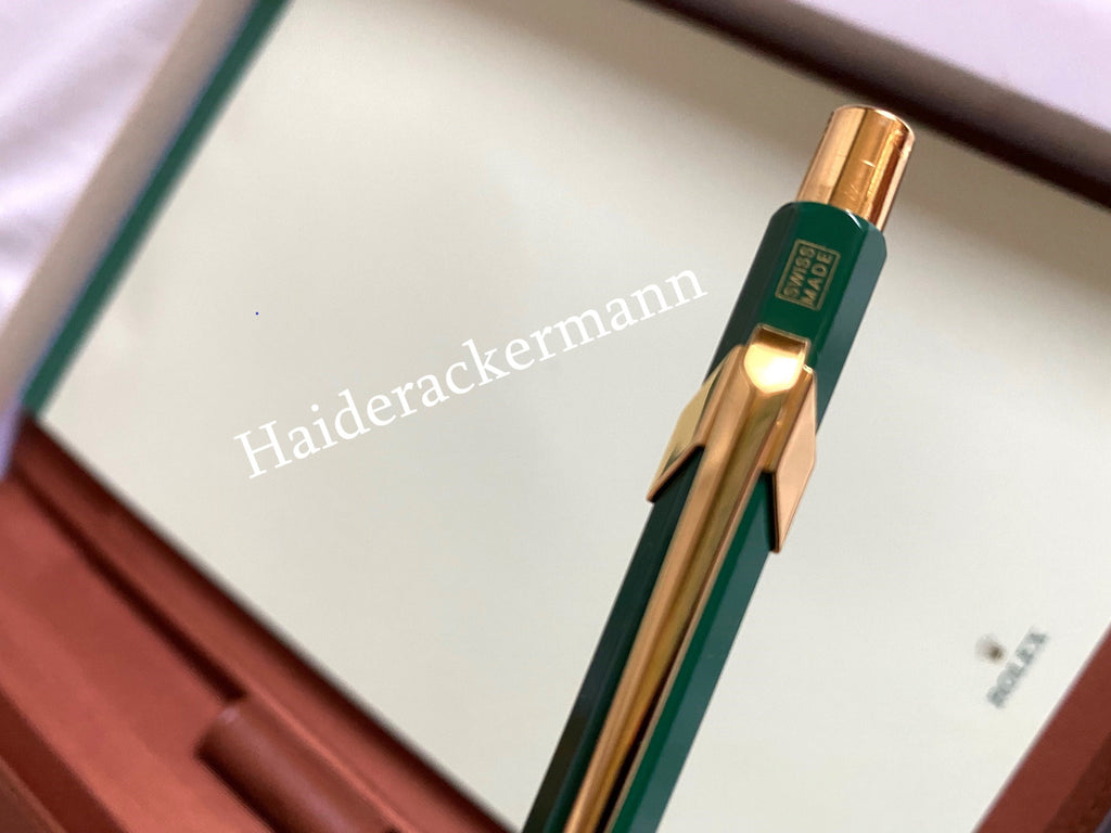Rolex notebook with leather case & Caran d’Ache pen