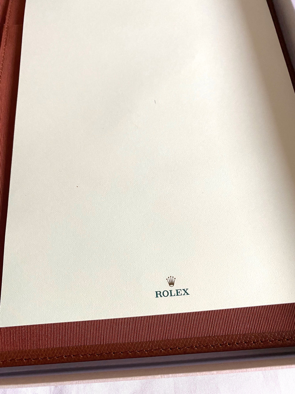 Rolex notebook with leather case & Caran d’Ache pen