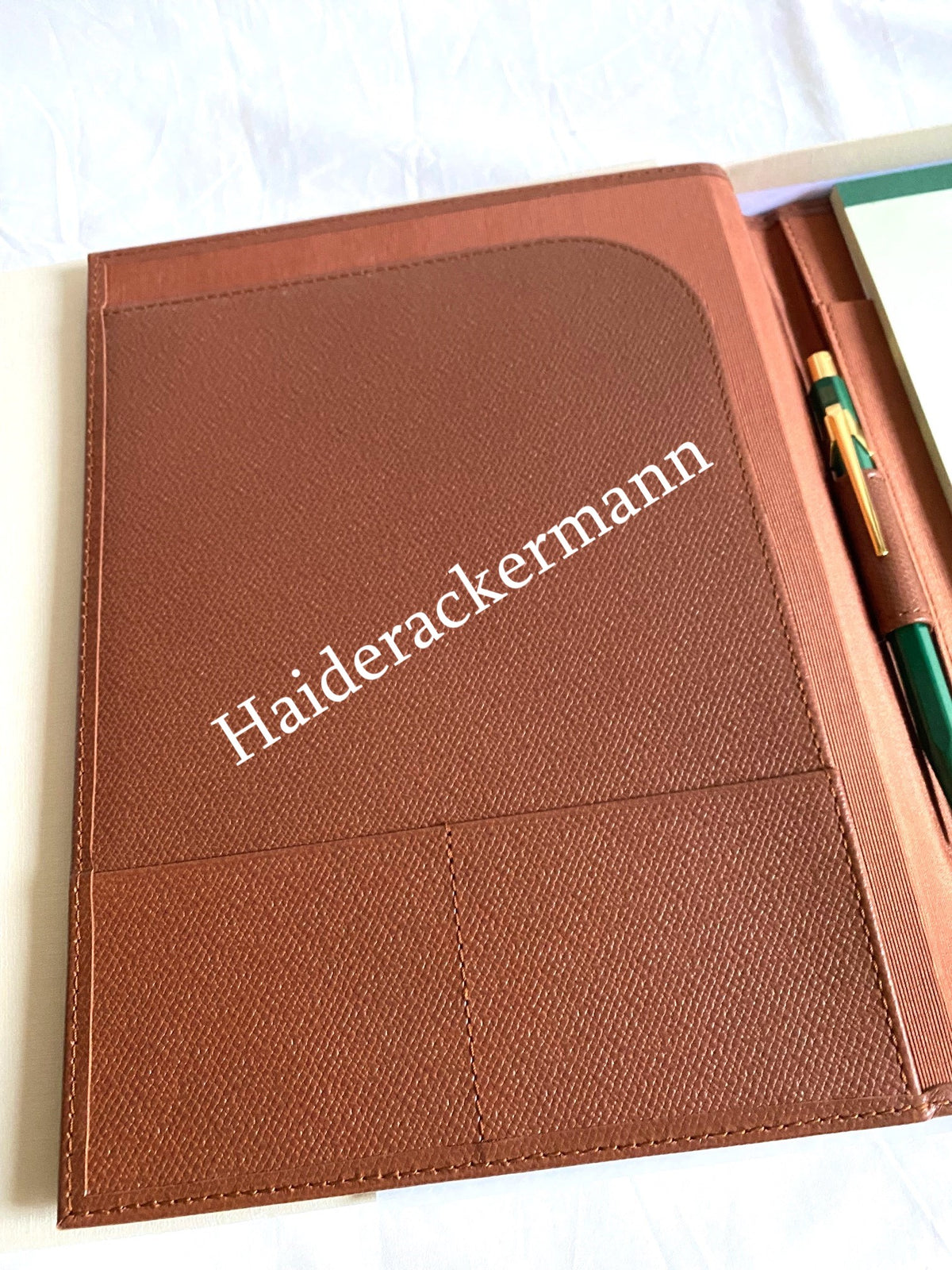 Rolex notebook with leather case & Caran d’Ache pen