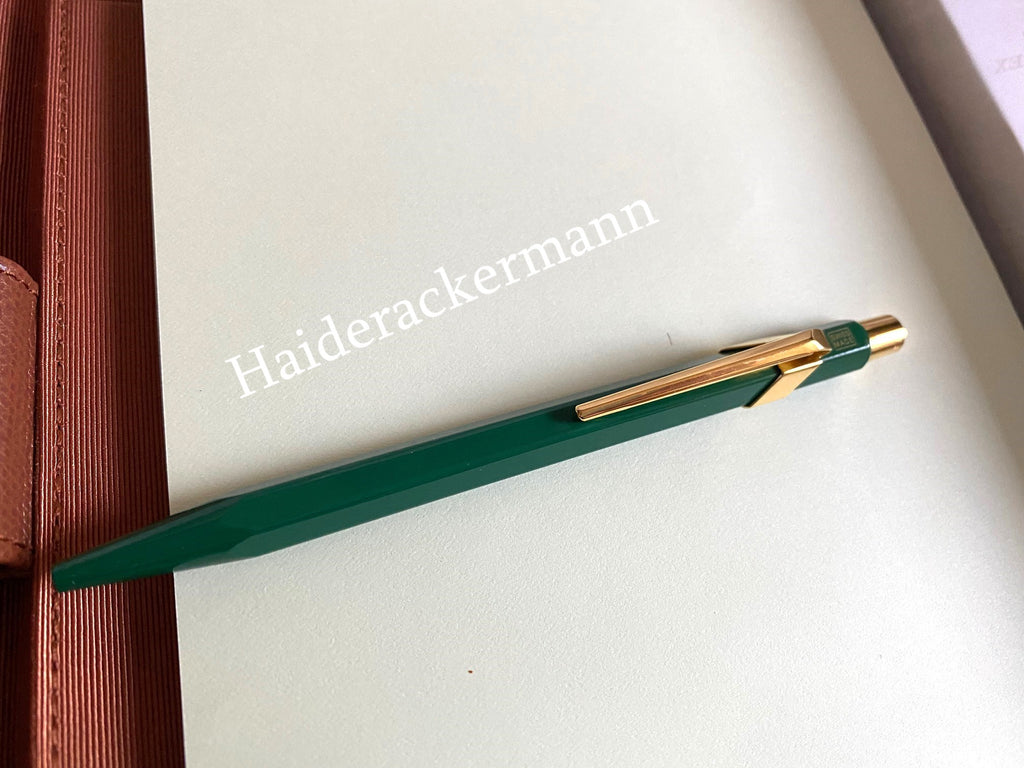 Rolex notebook with leather case & Caran d’Ache pen