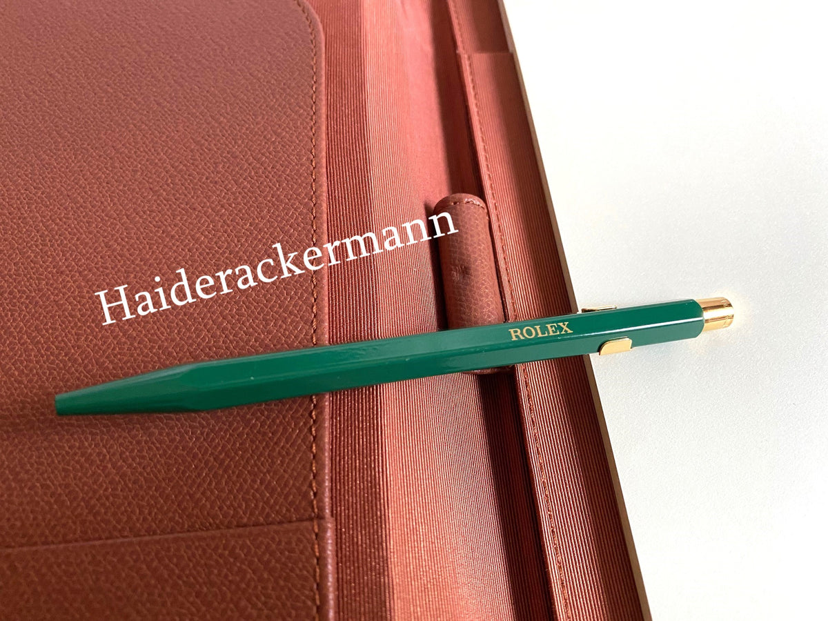 Rolex notebook with leather case & Caran d’Ache pen
